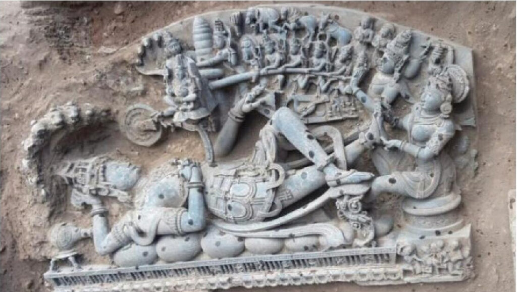 Lakshmi sitting at the feet of Lord Vishnu accompanied by a scene of churning of the sea is a rare type of linear sculpture.
